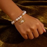 Bracelet élastique en perles de coquillages plaqué or en acier inoxydable style plage d'été DAIHE