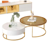 Table basse moderne convertible pour salon en verre blanc avec structure en métal doré et rangement