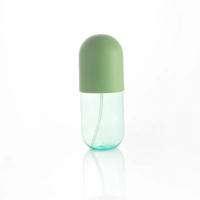 La pompe cosmétique en plastique transparente de jet met en bouteille l'emballage cosmétique de parfum de lotion de pulvérisateur de brume fine de forme de capsule de pilule