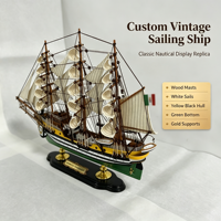 Modèle de bateau à voile vintage personnalisé en bois avec gréement multi-mâts, voiles blanches, coque jaune-noire et support noir