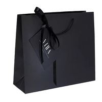 Sacs à provisions de luxe en carton imprimés de logo personnalisé pour cosmétiques vêtements chaussures Festival accessoires de mode poignées en papier