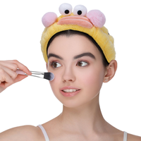 Bandeau élastique en peluche personnalisé avec logo, motif dessin animé mignon et amusant, pour le lavage du visage, le spa, le masque facial et le maquillage, avec bouche en forme de saucisse, pour femme