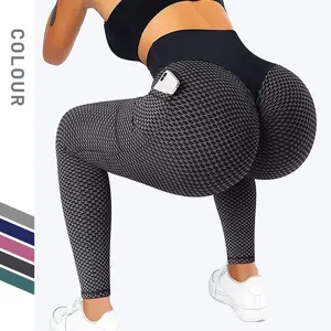 Collant sportivi per il sollevamento dell'anca a vita alta da donna OEM/personalizzati pantaloni ad asciugatura rapida pantaloni da Yoga a nido d'ape con anca color pesca al miele