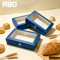 Boîte en papier bleue personnalisée en gros avec fenêtre transparente en PVC, boîte cadeau alimentaire pliable pour l'emballage de biscuits, pâtisseries et produits de boulangerie