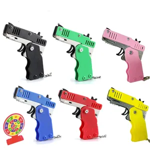 Legierung Kunststoff Platte Schlüsselanhänger mit Mini-Gummiband-Waffe Unisex-Kinderspielzeug Großhandel Metall und Gummiband Spielzeug Waffe