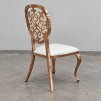 Chaise de banquet en acier inoxydable bronze avec dossier sculpté floral et siège en cuir PU