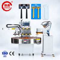Machine de scellage sous blister entièrement automatique à double manipulateur pour l'emballage sous blister de rasoirs et de lames de rasoir