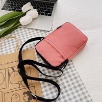 Sac bandoulière mini en toile pour femme 2026 avec fermeture éclair, pochette portable pour téléphone et monnaie, pochette en tissu verticale à suspendre au cou, usage quotidien, vente en gros