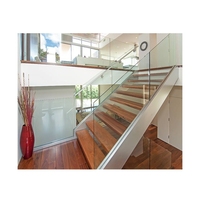 Escalier droit flottant de conception villa avec support en acier dissimulé et balustrades en verre pour escalier intérieur
