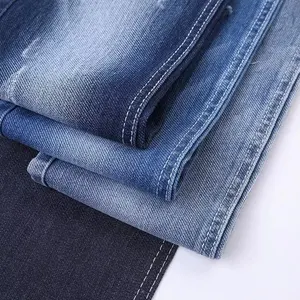 Wholesale high waist fashion, stack jeans distressed ripped blue washed hole Skinny Zipper Pocket denim fabric for men's jeans/
