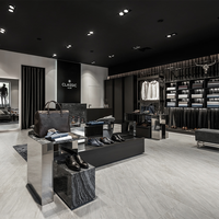 Meuble mural personnalisé pour hommes au détail Vitrine de vêtements en bois sur mesure Magasin de vêtements Design d'intérieur