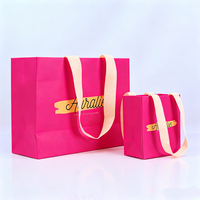 Fournisseur de sacs en papier kraft magenta imprimés, pliables, pour emballages cadeaux, cosmétiques, parfums, mode de luxe personnalisée pour mariage