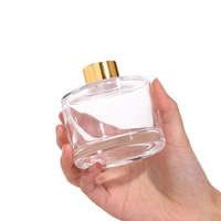 Vente en gros de bouteille diffuseur ronde de luxe personnalisée de 100ml 200ml bouteille vide en verre diffuseur d'anche avec couvercles