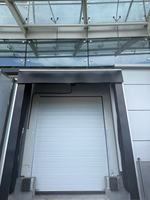 Porte de levage industrielle automatique segmentée surélevée pour entrepôt d'usine, personnalisée