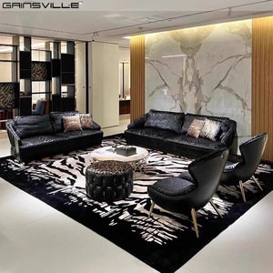 Ensemble de canapés de luxe italiens en cuir véritable de forme unique en or noir pour salon et appartement - Product Image 1