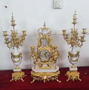 French Style Vintage 24K Gilt Solid Brass Two Boys Pulling Mechanical Table/Desk Clock on White Marble Base & Candelabras Sets