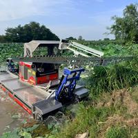Bateau tondeuse amphibie multifonction pour le contrôle des plantes aquatiques dans les zones humides.