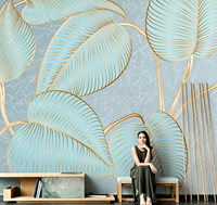 Papier peint mural en art linéaire doré avec des feuilles tropicales bleues pour salon de beauté, salon et boutique