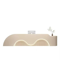 Bureau de réception de luxe style crème à double vague incurvée avec éclairage LED pour salon de beauté