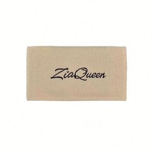 Etiquetas de algodón tejidas personalizadas con logo para el cuidado de la ropa, con fuente orgánica y pliegue central para prendas. - Product Image 2