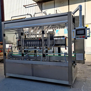 Botella de vidrio Seguimiento Vino Vinagre Agua mineral Líquido Máquina de llenado al vacío para Malta con transportador - Product Image 1