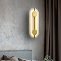 Applique murale LED moderne de luxe en cuivre avec design créatif en marbre pour le salon, la chambre à coucher et l'éclairage de l'allée de l'hôtel
