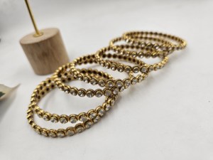 Traditional gold-plated daily wear <b>bangles</b> featuring a sleek circular design adorned with white stones <b>set</b> - Product Image 2