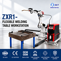 Station de soudage robotisée industrielle avec table de soudage modulaire flexible et outillage de fixation pour cylindre d'amortisseur