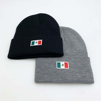 Bonnet tricoté côtelé à revers en acrylique couleur unie avec étiquette tissée personnalisée, style streetwear, chaud pour l'hiver, vente en gros