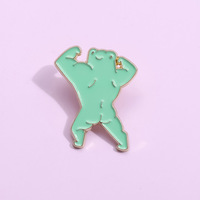 Großhandel Metall-Cartoon-Pins: Kreative, niedliche grüne Muskel-Frosch-Brosche, lustiges Deko-Pin-Accessoire für Taschen & Kleidung