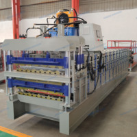 Machine de formage à rouleaux triple couche : Une machine pour la production de tuiles émaillées, de tôles ondulées à effet d'eau et de panneaux de toiture.