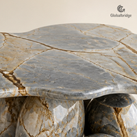 Table en pierre naturelle de quartzite bleu Roma personnalisée, modèle Couronne de pétales, pour projets hôteliers et villas