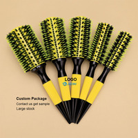 Brosse à cheveux ronde populaire en nylon à poils souples, résistante à la chaleur, avec manche caoutchouté, revêtement céramique et corps ventilé en aluminium pour le coiffage