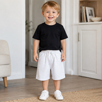 Pantalon de sport pour enfants, coupe droite, mi-mollet, taille élastique, en polyester/coton respirant, léger et doublé, idéal pour l'été et le quotidien.