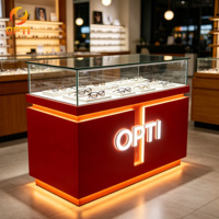 Vitrine d'exposition de lunettes optiques en verre esthétique de luxe haut de gamme avec éclairage LED pour centre commercial
