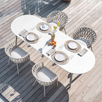 Ensemble table et chaises de salle à manger d'extérieur nordique, structure en aluminium épais, chaise en sangle d'oléfine, plateau en pierre frittée, mobilier de patio
