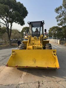 Chargeuse sur pneus compacte d'occasion Komatsu WA100 avec moteur SAA4D94LE-3, charge nominale de 7065 kg, puissance de 69,8 kW - Product Image 1