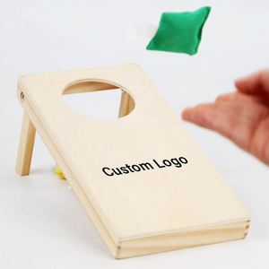 Mini juego de Cornhole de madera para niños - Juguete educativo portátil y ecológico de mesa con bolsa de transporte - Product Image 1