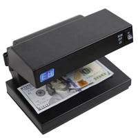 Détecteur de billets de banque portable LED UV en plastique DC-2238B pour la détection de faux billets multidevises USD Euro GBP