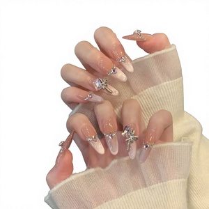 Autocollants d'ongles artificiels sophistiqués de style nouveau, en strass rose clair effet œil de chat, forme amande, pour un look glacé et atmosphérique - Product Image 1