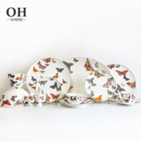 Service de table de luxe en porcelaine fine, motif papillon, avec bol, tasse et soucoupe, idéal pour événements, traiteur et location