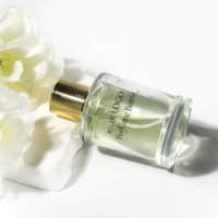 Bouteille de parfum en verre cylindrique de luxe de 100ml boîte d'emballage de cosmétiques vide avec atomiseur de pompe de pulvérisation pour bouteille d'huile essentielle