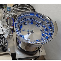 Remplisseuse de liquide automatique pour flacons compte-gouttes et flacons à bille avec dosage et bouchage précis