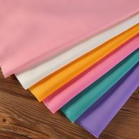 Tissu en polyester teint de haute qualité pour vêtements et textiles de maison
