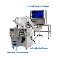 Machine d'emballage automatique de sachets de thé pyramidaux Vgopack avec peseuse à 6 têtes et alimentation manuelle par bande pour l'emballage de sachets de thé triangulaires aux herbes