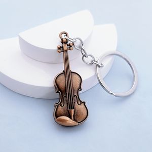 Llavero de metal vintage con guitarra y violín, accesorio colgante creativo y personalizado - Product Image 1