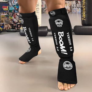 GINGPAI MMA <span class=keywords><strong>Protège</strong></span>-pieds <span class=keywords><strong>protège</strong></span>-tibias en tricot avec crochet et boucle de protection pour Muay <span class=keywords><strong>Thai</strong></span> Kick Boxing - Product Image 1
