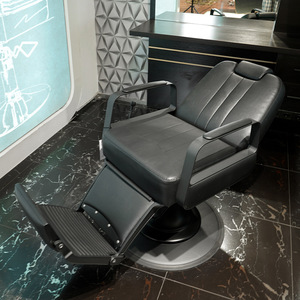 Modern Black Faux Leather Hydraulic Barber Chair with Adjustable <b>Footrest</b> and Round Base Contemporary Salon Furniture - Product Image 3