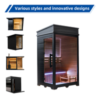 Cabine de sauna intérieure traditionnelle en bois de pruche pour 1 personne avec porte vitrée et banc, cadre noir moderne pour spa haut de gamme à domicile