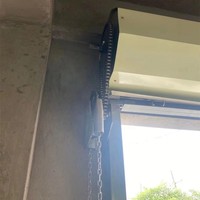 Treuil à chaîne manuel pour porte de garage à enroulement